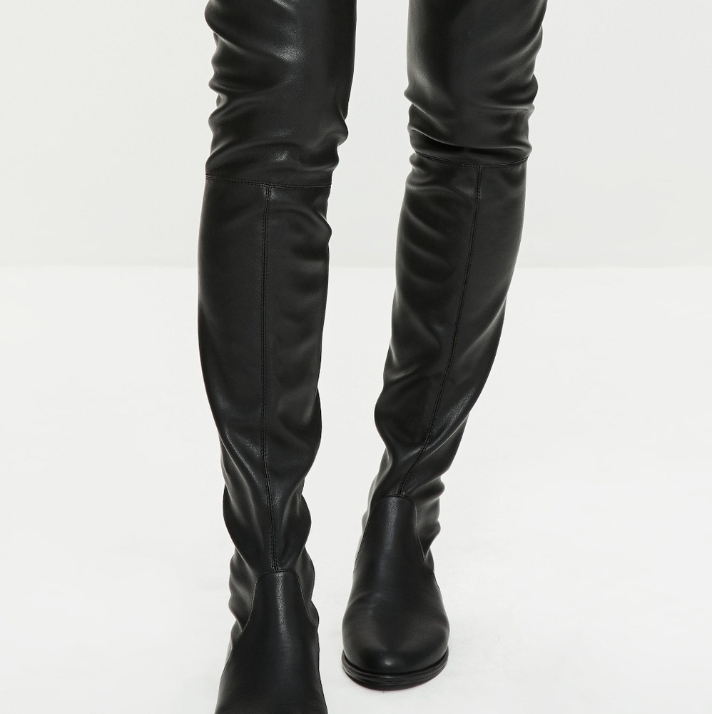 Black lather over the knee boots.